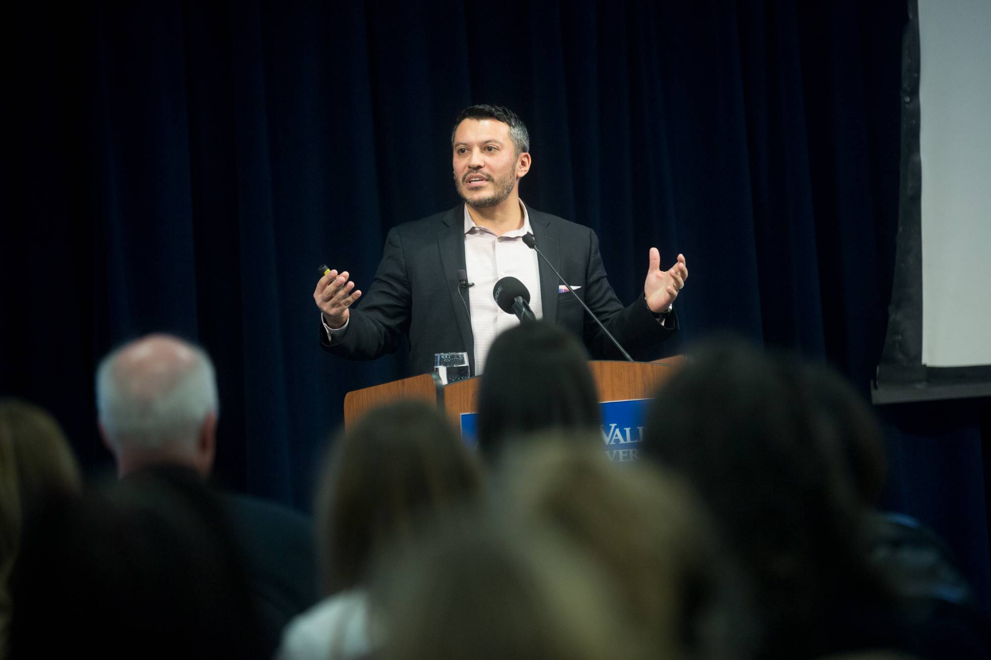 luis avila speaking at event
